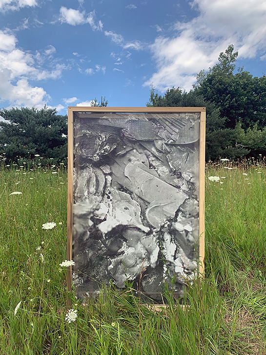 Abstract artwork installation in a meadow